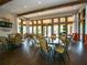 Bright and spacious resident lounge with plenty of seating, large windows, and views of the community at 2525 Vaccaro Dr, Sarasota, FL 34231