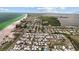 An aerial view of the community with its proximity to the Gulf and a canal system at 2601 Gulf N Dr # 317, Bradenton Beach, FL 34217