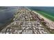 Aerial view of coastal neighborhood, located near a beautiful beach and stunning blue ocean at 2601 Gulf N Dr # 317, Bradenton Beach, FL 34217
