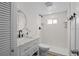 Modern bathroom featuring a stylish vanity, white subway tile shower, and sleek black fixtures at 2601 Gulf N Dr # 317, Bradenton Beach, FL 34217
