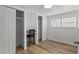 Bedroom featuring a desk, closet and wood laminate flooring at 2601 Gulf N Dr # 317, Bradenton Beach, FL 34217