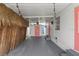 View of covered carport with string lights, leading to front entrance, offering ample space for parking at 2601 Gulf N Dr # 317, Bradenton Beach, FL 34217