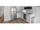 Bright white kitchen with stainless steel appliances, modern cabinets, and stylish subway tile backsplash at 2601 Gulf N Dr # 317, Bradenton Beach, FL 34217