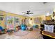 Bright living room with wood floors, plenty of natural light and casual decor at 28442 Coco Palm Dr, Punta Gorda, FL 33982