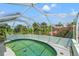 Screened in pool with a beautiful view of Florida's natural foliage at 28442 Coco Palm Dr, Punta Gorda, FL 33982