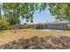 A sprawling backyard offers a mix of grassy and shaded areas, perfect for outdoor enjoyment and gardening at 301 89Th Ne Ave, St Petersburg, FL 33702