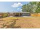 A large backyard with a covered patio offers plenty of space for recreation and relaxation at 301 89Th Ne Ave, St Petersburg, FL 33702
