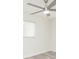 Bright bedroom featuring wood-look floors and a modern ceiling fan for added comfort at 301 89Th Ne Ave, St Petersburg, FL 33702