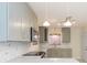 Bright kitchen featuring modern backsplash, counter tops, updated cabinets and stainless steel appliances at 301 89Th Ne Ave, St Petersburg, FL 33702