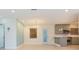 Open living space featuring tile floors, recessed lighting, and a seamless transition to the kitchen at 301 89Th Ne Ave, St Petersburg, FL 33702