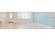 Bright living room featuring tile floors and an abundance of natural light at 301 89Th Ne Ave, St Petersburg, FL 33702