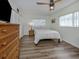 Bright bedroom with a natural-colored dresser, and lots of sunlight, creating a cozy and relaxing atmosphere at 340 Base E Ave # 314, Venice, FL 34285
