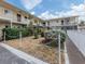 Manicured condo courtyard with fence and walkway showing well maintained community at 340 Base E Ave # 314, Venice, FL 34285