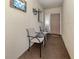 Private front porch has tile floor and chairs for relaxing outdoors at 340 Base E Ave # 314, Venice, FL 34285
