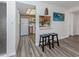 Open-concept design offering a peek into a traditionally styled kitchen with stainless steel appliances and lots of natural light at 340 Base E Ave # 314, Venice, FL 34285