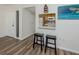 An inviting kitchen view showcasing a traditional style with light-colored cabinets and modern flooring at 340 Base E Ave # 314, Venice, FL 34285