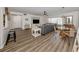 Open living room boasts modern flooring, stylish furnishings, and natural light at 340 Base E Ave # 314, Venice, FL 34285