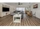 Spacious living room featuring luxury vinyl floors and contemporary decor at 340 Base E Ave # 314, Venice, FL 34285