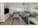 Expansive living area featuring comfortable seating, sleek TV console, and large windows offering plenty of natural light at 340 Base E Ave # 314, Venice, FL 34285