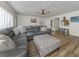 Expansive living room featuring modern flooring, ceiling fan, and ample seating at 340 Base E Ave # 314, Venice, FL 34285