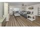 Bright living room featuring stylish decor, new floors, and a spacious layout at 340 Base E Ave # 314, Venice, FL 34285