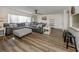 The sprawling living room has seating for everyone and newer flooring at 340 Base E Ave # 314, Venice, FL 34285