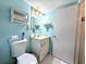Bathroom with a toilet, vanity, and decor shelves at 3559 Lake Bayshore Dr # J-204, Bradenton, FL 34205