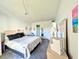 Bedroom with a bed, dresser, and mirrored vanity, illuminated by natural light at 3559 Lake Bayshore Dr # J-204, Bradenton, FL 34205