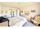 Bedroom featuring a dresser, decor, and comfortable seating at 3559 Lake Bayshore Dr # J-204, Bradenton, FL 34205