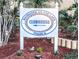 Bayshore on the Lake clubhouse sign surrounded by trees and mulch at 3559 Lake Bayshore Dr # J-204, Bradenton, FL 34205