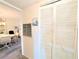 Hallway view featuring closet, painted walls, air vent and access to the dining room at 3559 Lake Bayshore Dr # J-204, Bradenton, FL 34205