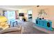 Bright living room with a sliding door to the balcony and an adjacent bedroom at 3559 Lake Bayshore Dr # J-204, Bradenton, FL 34205
