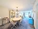 Cozy living space featuring an octagon dining table and access to the living room with sliding glass doors at 3559 Lake Bayshore Dr # J-204, Bradenton, FL 34205