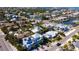 Aerial view showcases the neighborhood, canals, and waterfront access from this beautiful light blue home at 403 75Th St, Holmes Beach, FL 34217