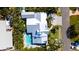Overhead view showcases the meticulously landscaped property, pool, and neighborhood street at 403 75Th St, Holmes Beach, FL 34217