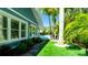 Lush backyard featuring a pool and meticulously maintained landscaping at 403 75Th St, Holmes Beach, FL 34217