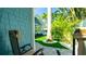 Landscaped backyard view from patio with stone pavers and palm trees at 403 75Th St, Holmes Beach, FL 34217