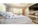 Light and airy bedroom with window shutters, flat screen tv and coastal decor at 403 75Th St, Holmes Beach, FL 34217
