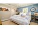 Charming bedroom with coastal accents, window shutters, and a comfortable inviting bed at 403 75Th St, Holmes Beach, FL 34217