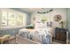 Inviting bedroom with coastal decor, shuttered windows, and a comfortable bed at 403 75Th St, Holmes Beach, FL 34217