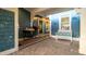 Charming blue home exterior with a decorated front porch and stylish bicycle decor at 403 75Th St, Holmes Beach, FL 34217