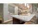 Bright kitchen with oversized island, white cabinetry and modern backsplash at 403 75Th St, Holmes Beach, FL 34217