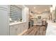 Beautiful kitchen featuring custom cabinets, tile backsplash, and stainless appliances at 403 75Th St, Holmes Beach, FL 34217