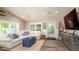 Cozy living room with a white sectional sofa, blue accents, and decorative beach-themed elements at 403 75Th St, Holmes Beach, FL 34217