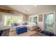 Comfortable living room featuring a white sectional, blue accents, and coastal-inspired decor at 403 75Th St, Holmes Beach, FL 34217