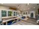 Open-concept living area with a dining table, seating area, and coastal-inspired decor at 403 75Th St, Holmes Beach, FL 34217