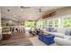 Spacious living space with dining area, comfortable seating, and stylish decor, perfect for entertaining at 403 75Th St, Holmes Beach, FL 34217