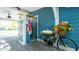 Outdoor shower featuring blue shingle siding, stylish fixtures, and a surfboard accent at 403 75Th St, Holmes Beach, FL 34217