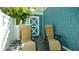 Relaxing patio area with comfortable lounge chairs and privacy fence at 403 75Th St, Holmes Beach, FL 34217