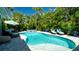 Private backyard with a refreshing pool, spa, and comfortable lounge furniture at 403 75Th St, Holmes Beach, FL 34217